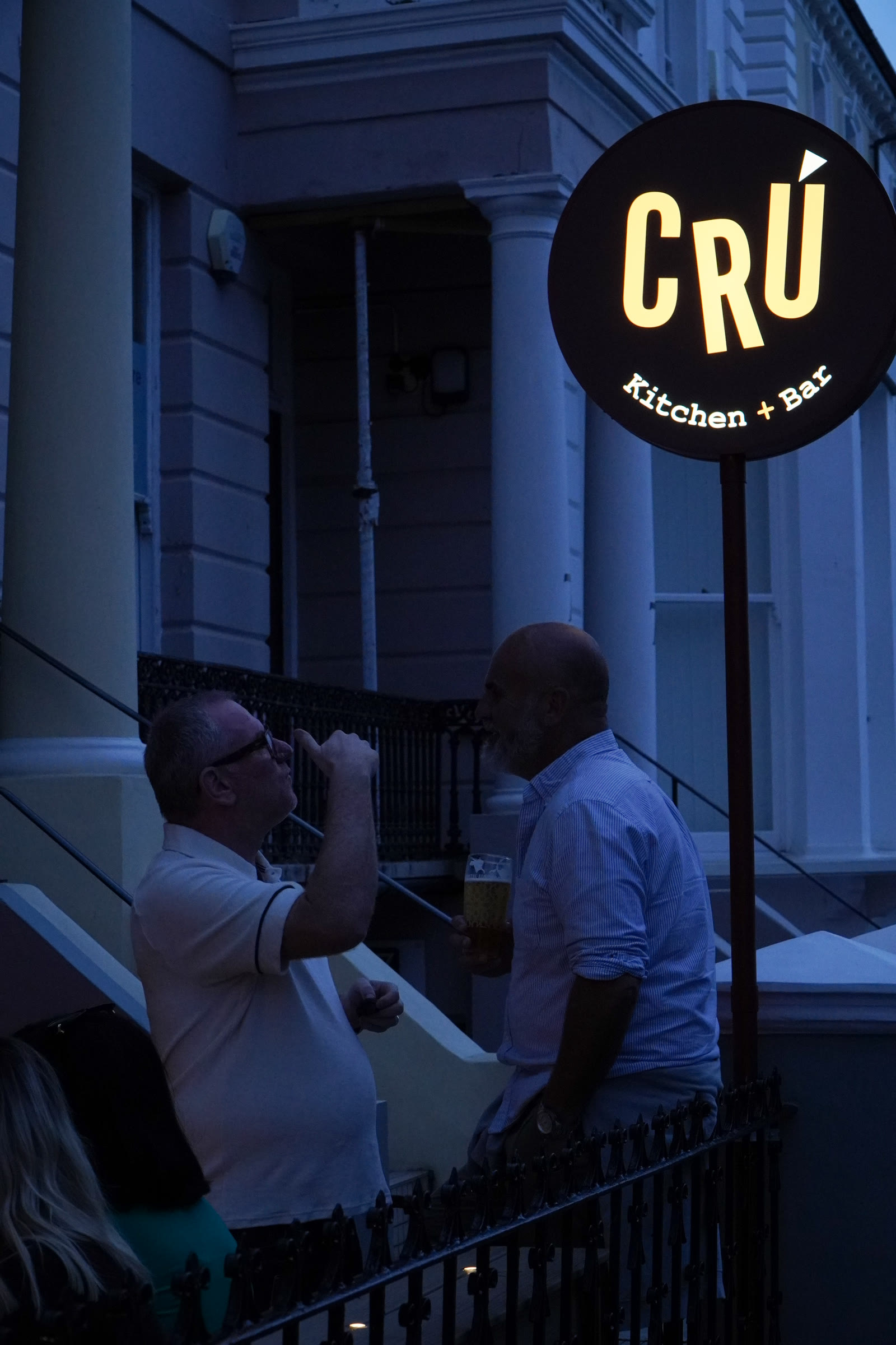 Cru sign lit at night